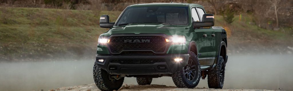Ram 1500 surrounded by mountains showing its towing capacity.